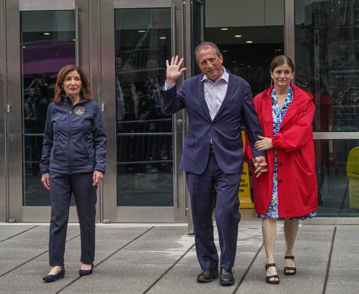 Brad Lander waves alongside wife and governor